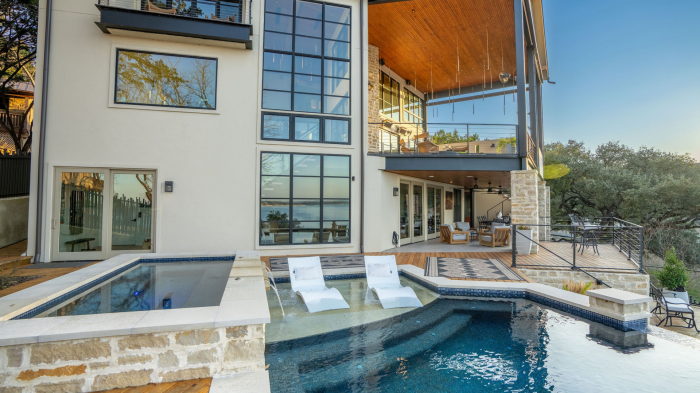 Luxury custom home with pool and patio balcony at Canyon Lake Texas